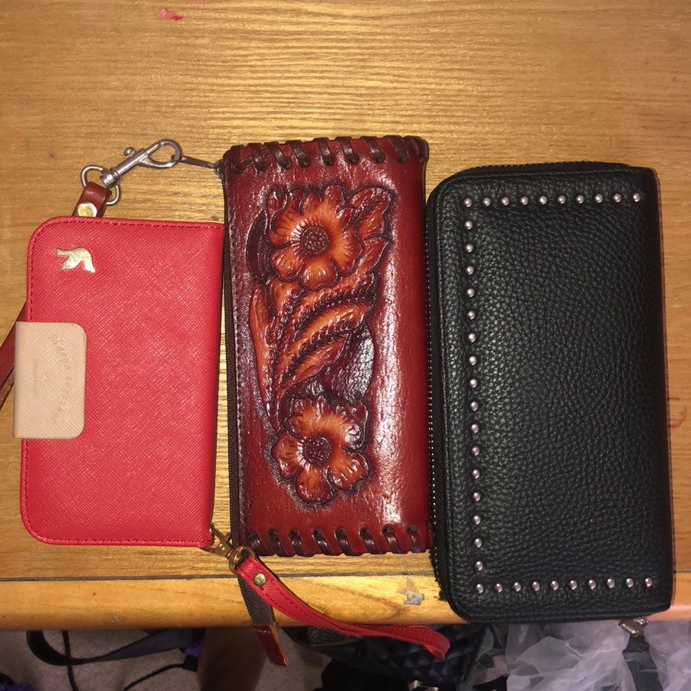 Three assorted wallets